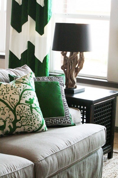 Green accents in pillows and curtains