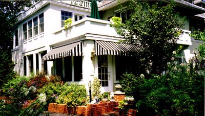 Home with striped awnings