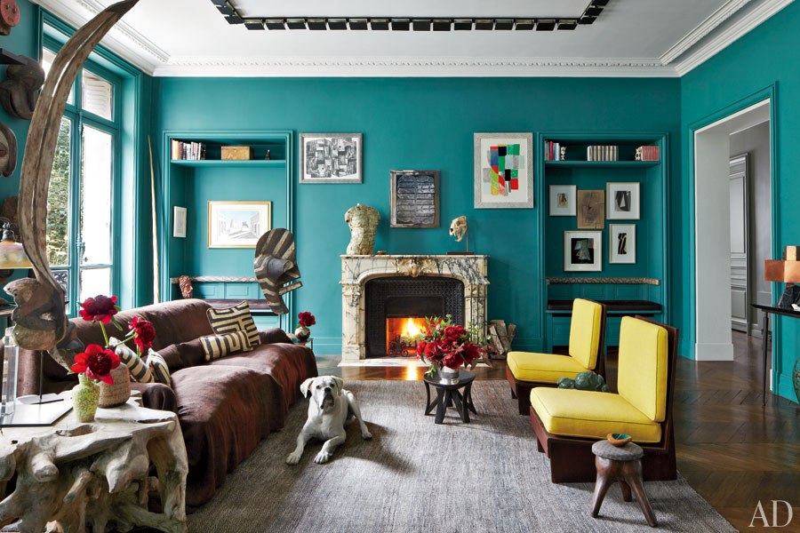 Bold turquoise walls with unique element on ceiling